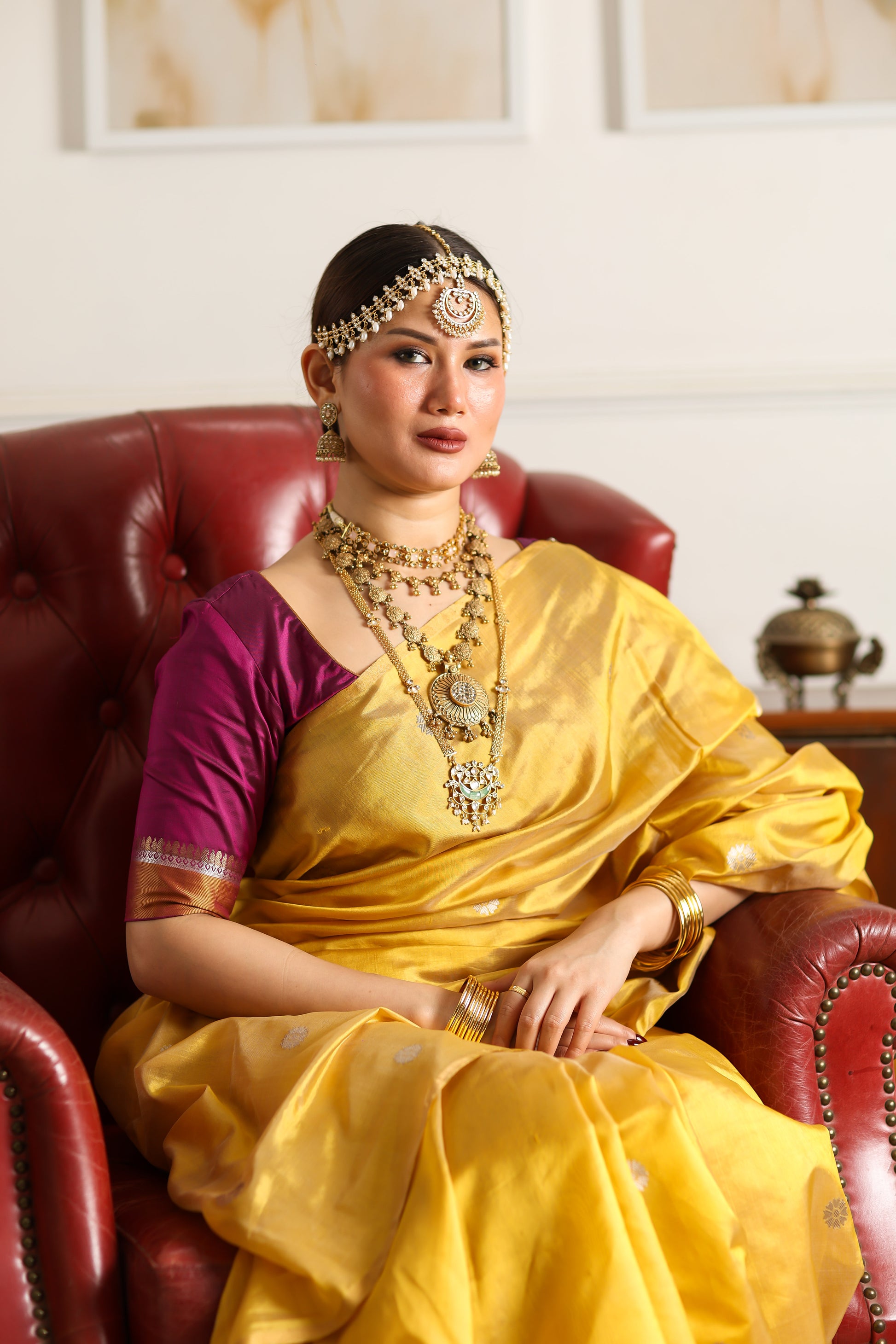 Yellow pure chanderi silk handwoven saree with thin zari border and meenakari buttis, front angle 2