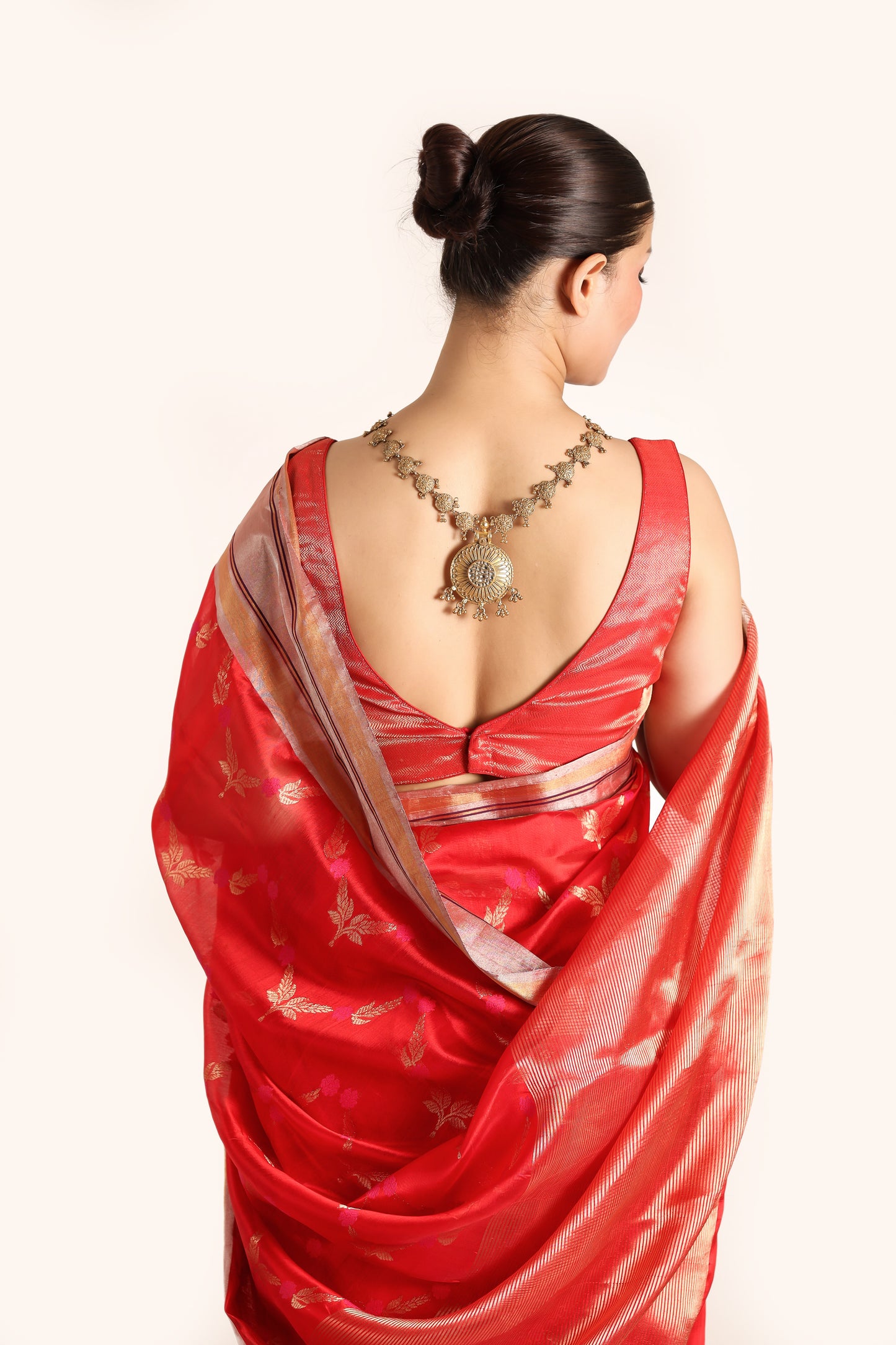 Red pure chanderi silk handwoven saree with all over meenakari buttis , back close up