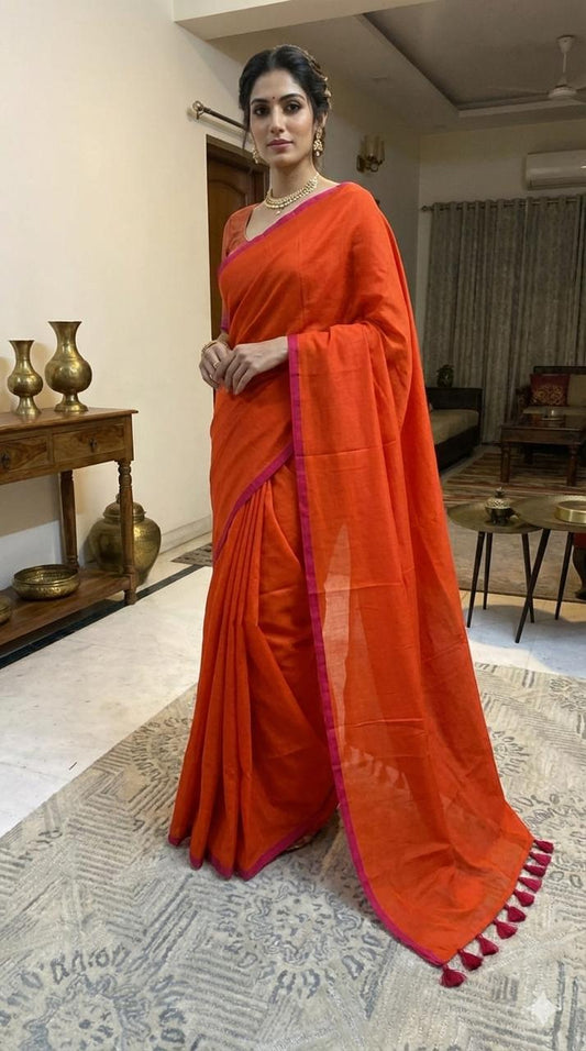 Orange pure hand-woven khadi cotton saree with pink selvage and tassels