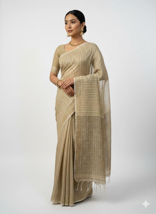 Woman wearing a beige saree with a white background